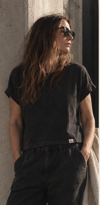 Model wearing the AFTR 001 faded black tee, showing its neckline, sleeves and hem